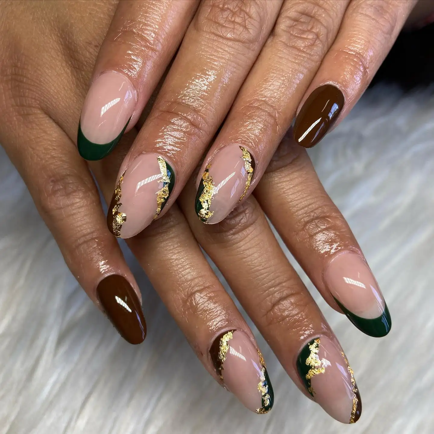Long coffin-shaped nails with intricate white wrap detailing and striking red eyes peeking through.