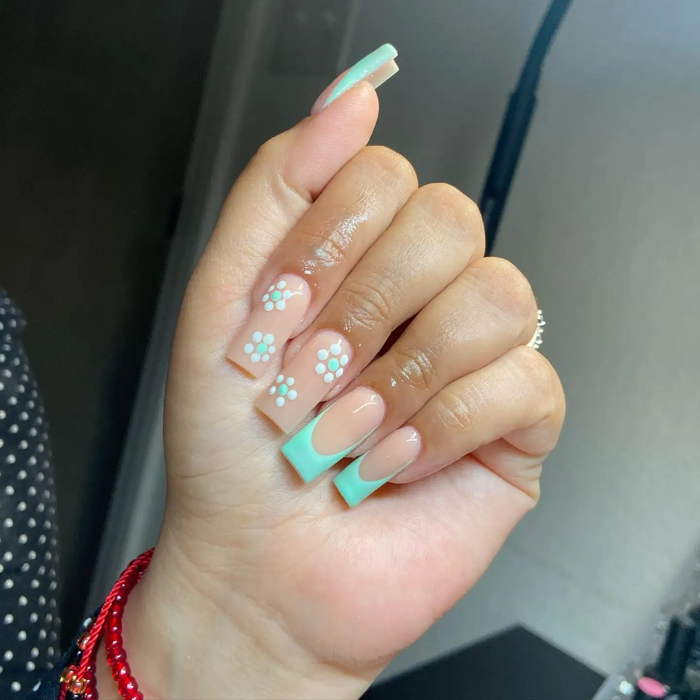 Short nails with alternating black and white wrap-inspired patterns, featuring large cartoon-style eyes on two nails.