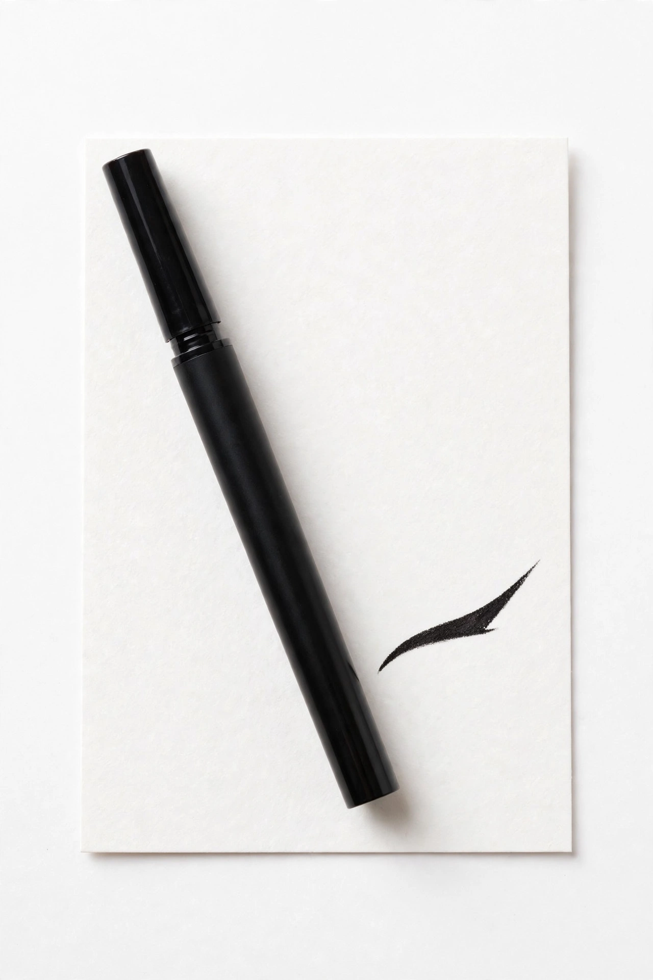 NYX Epic Ink waterproof liquid eyeliner pen drawing a wing