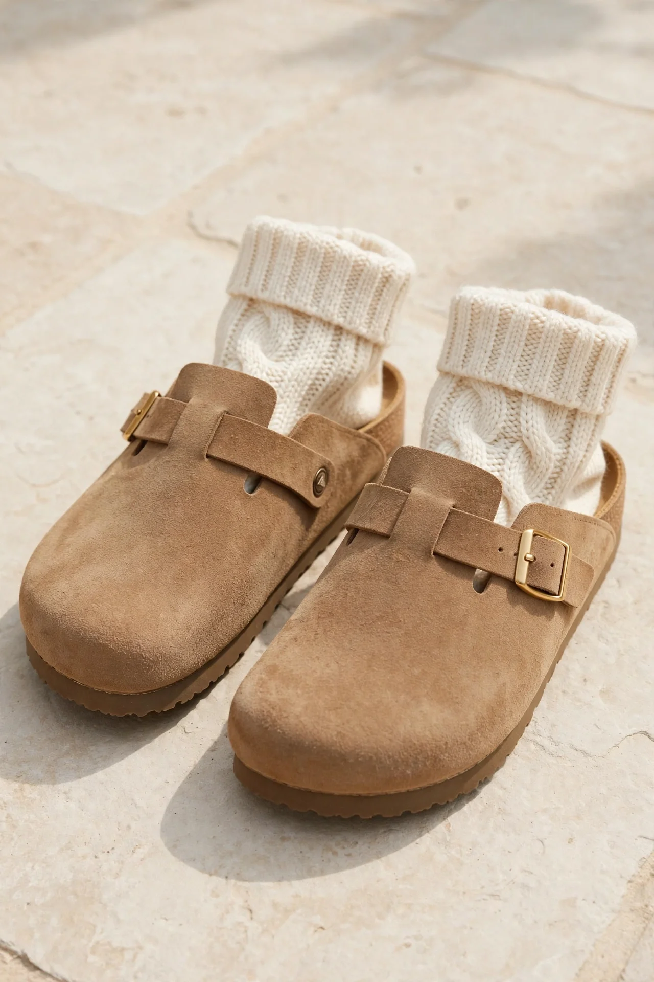 Tan suede clogs with buckles and cream socks
