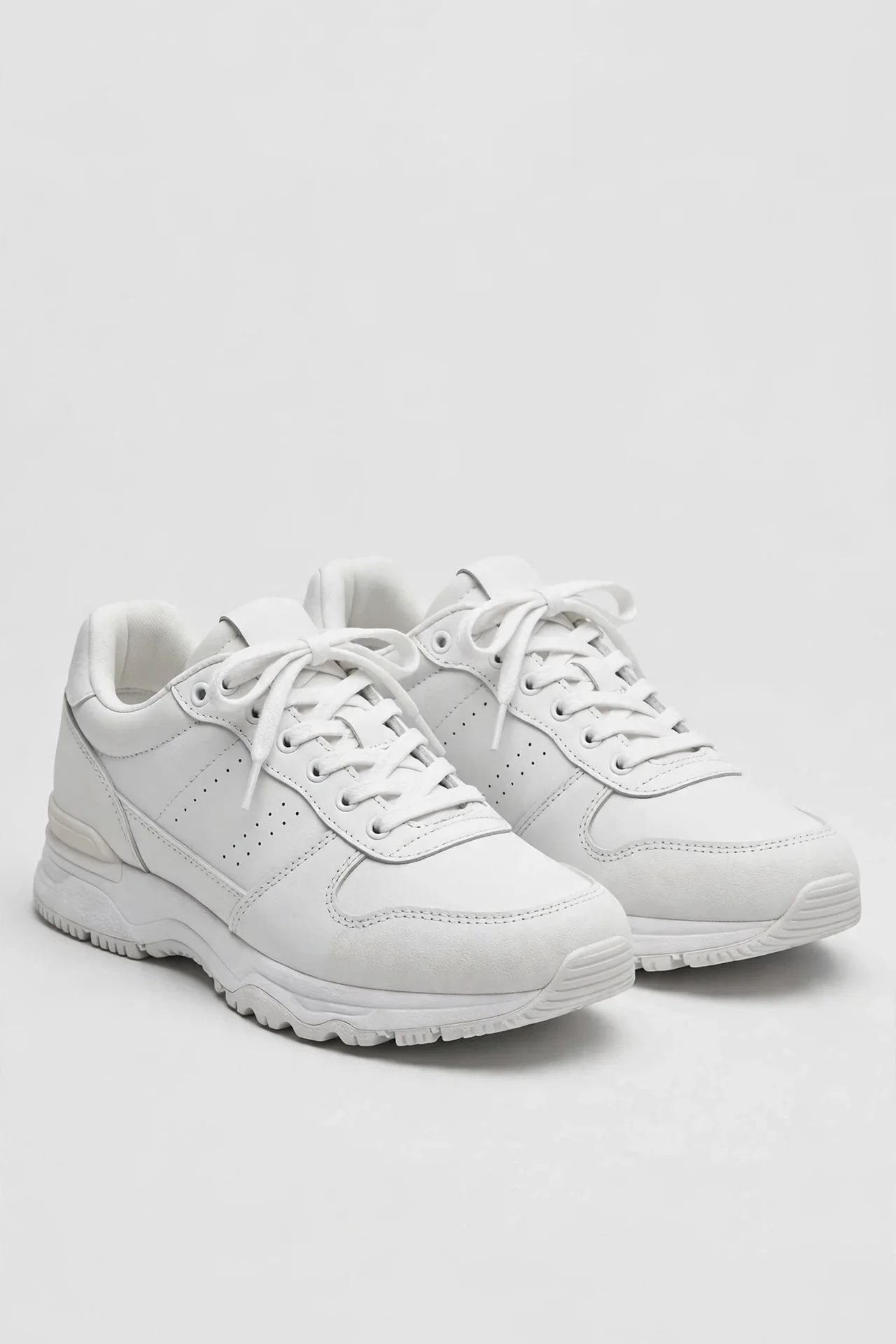 White cushioned walking sneakers with retro toe cap