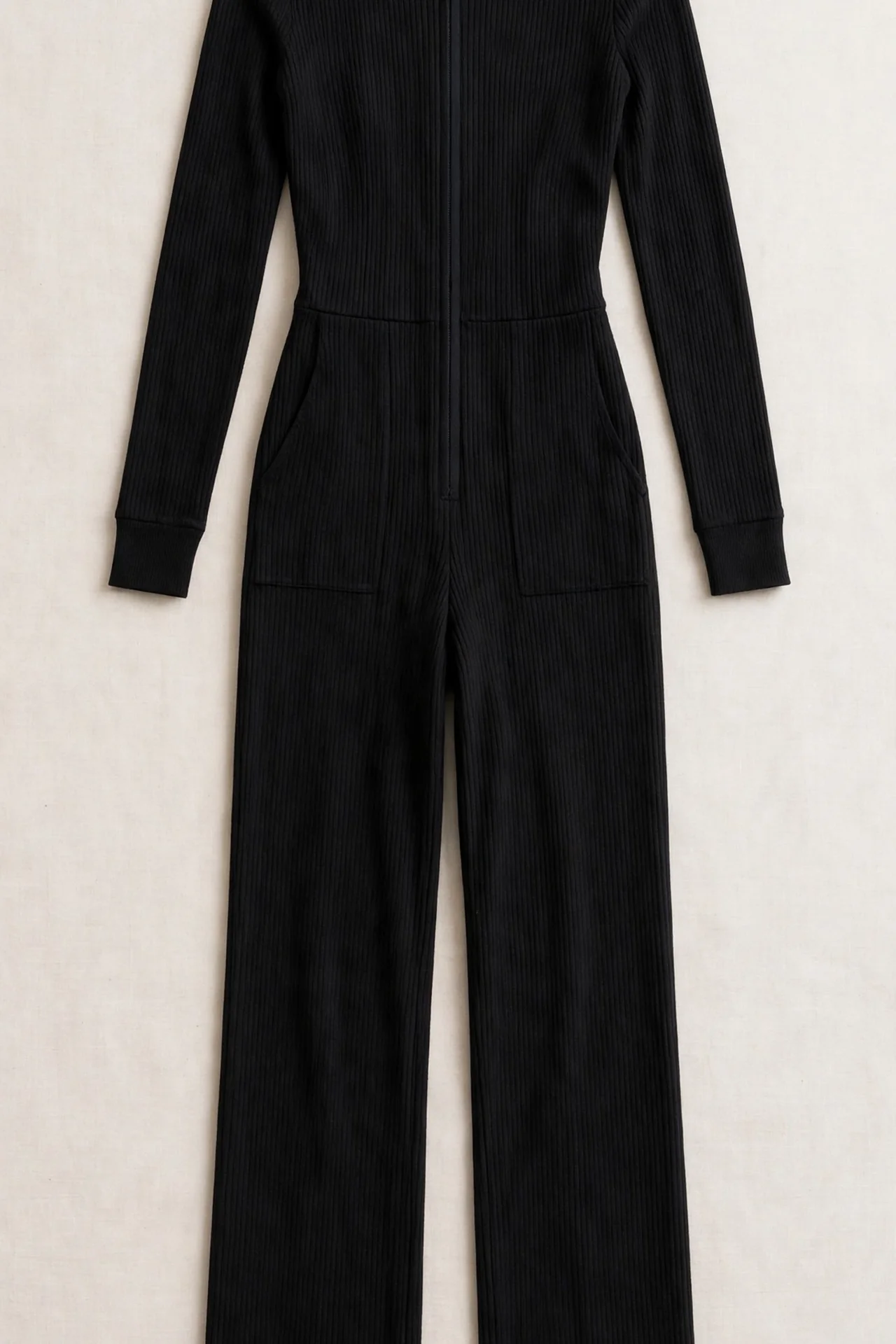 Black ribbed jumpsuit, flat lay