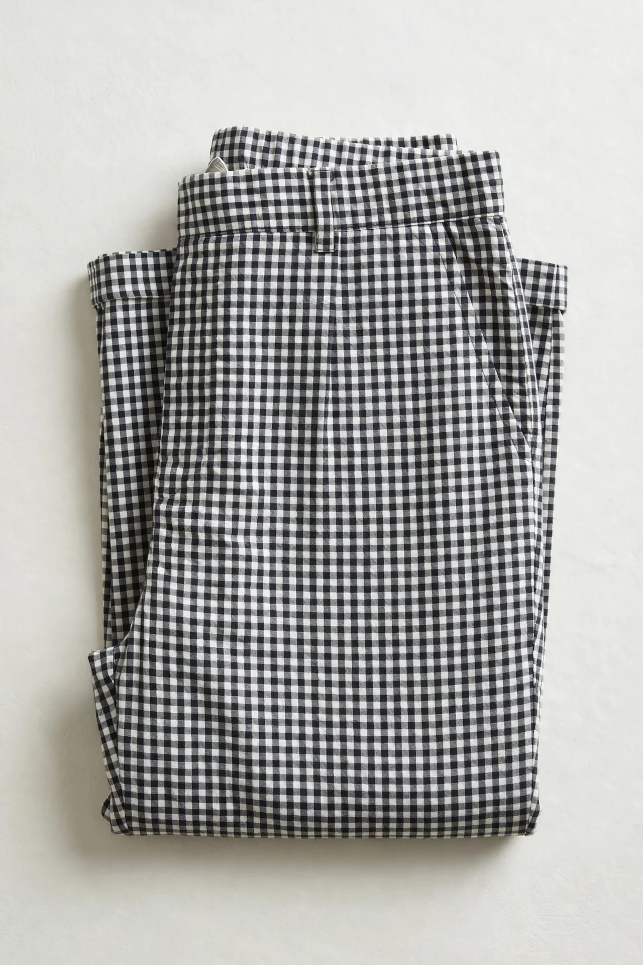 Black-and-white gingham lounge pants, folded