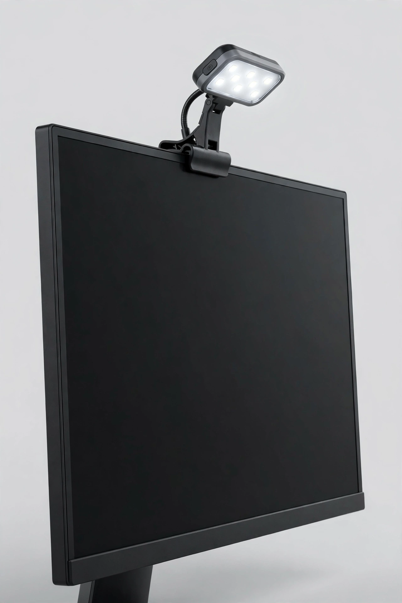 Clip-on LED light attached to a monitor
