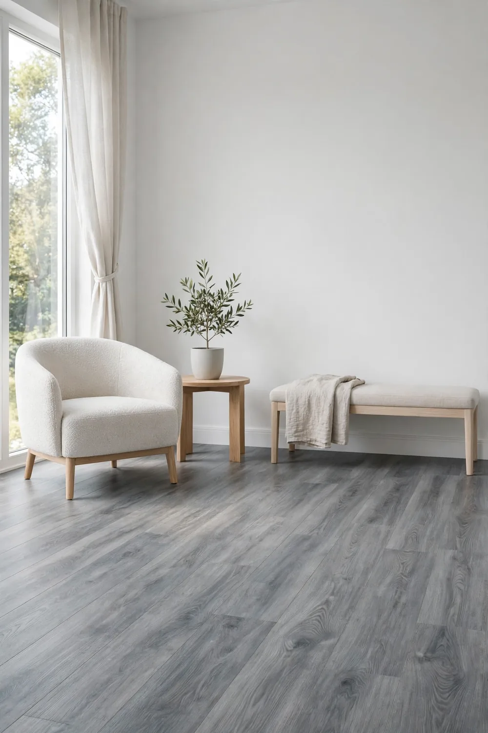 Gray vinyl plank flooring in a minimalist room