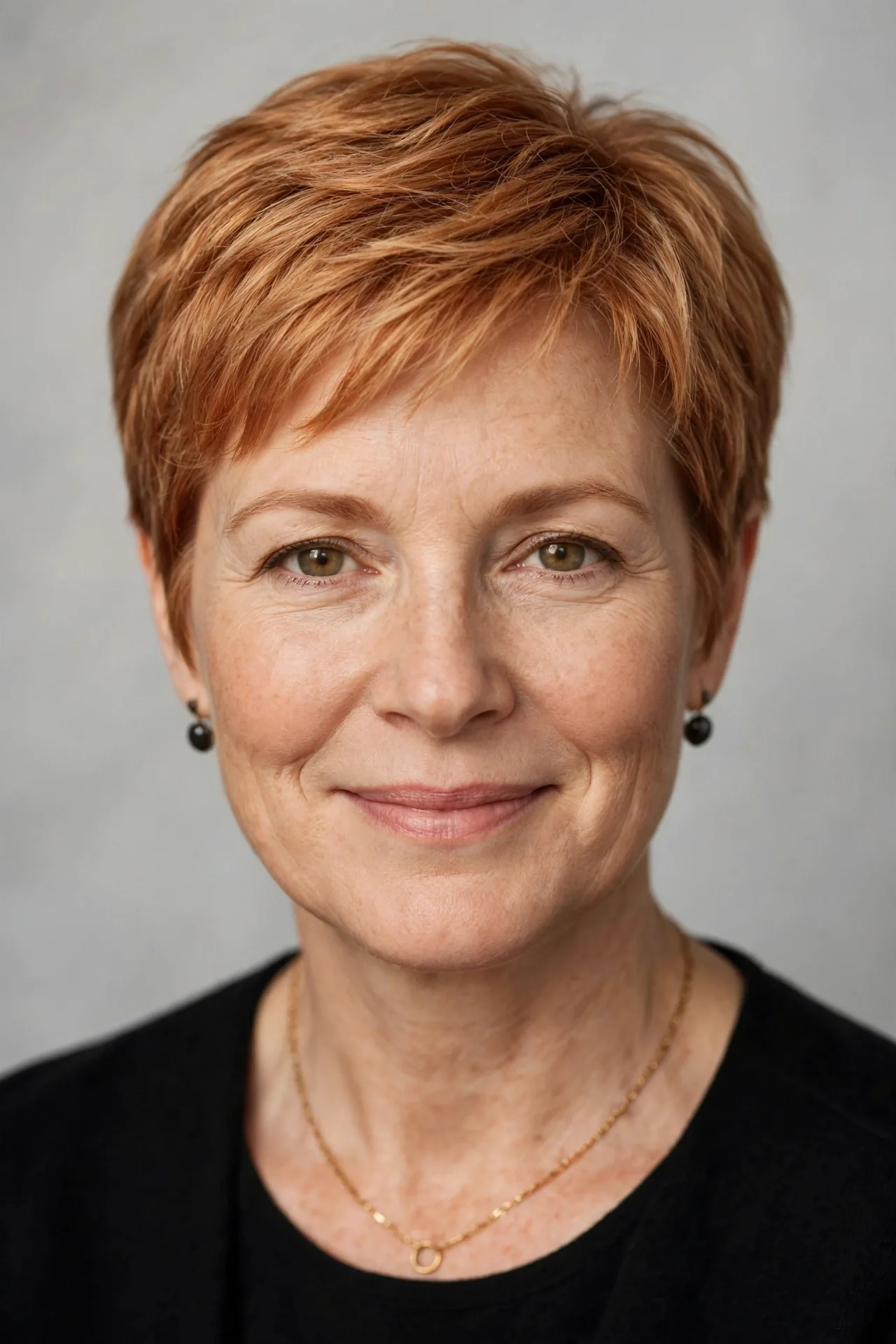 Susan Haynie smiling warmly in a formal portrait
