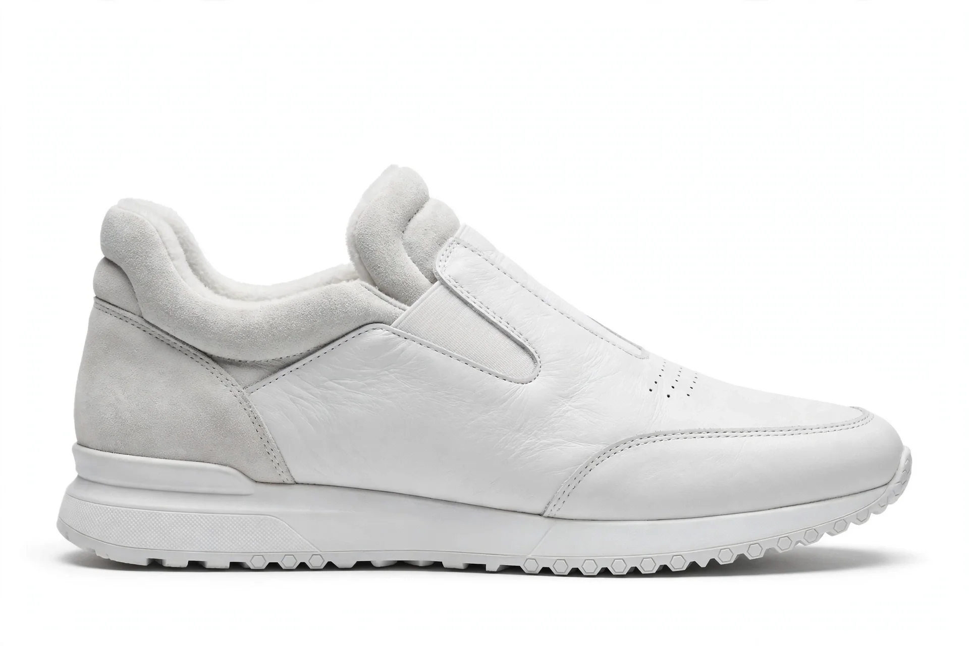 Sleek white leather and suede hands-free slip-on sneaker with a cushioned collar