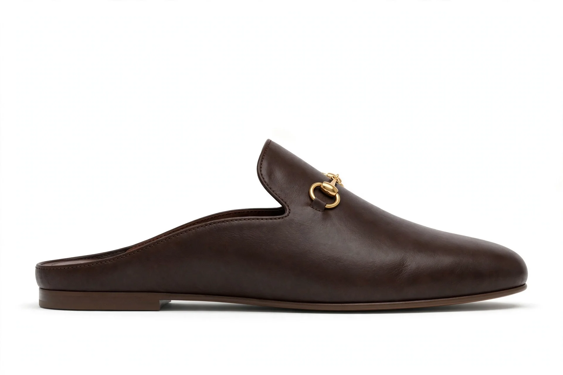Dark-brown flat leather mule with small gold horsebit detail