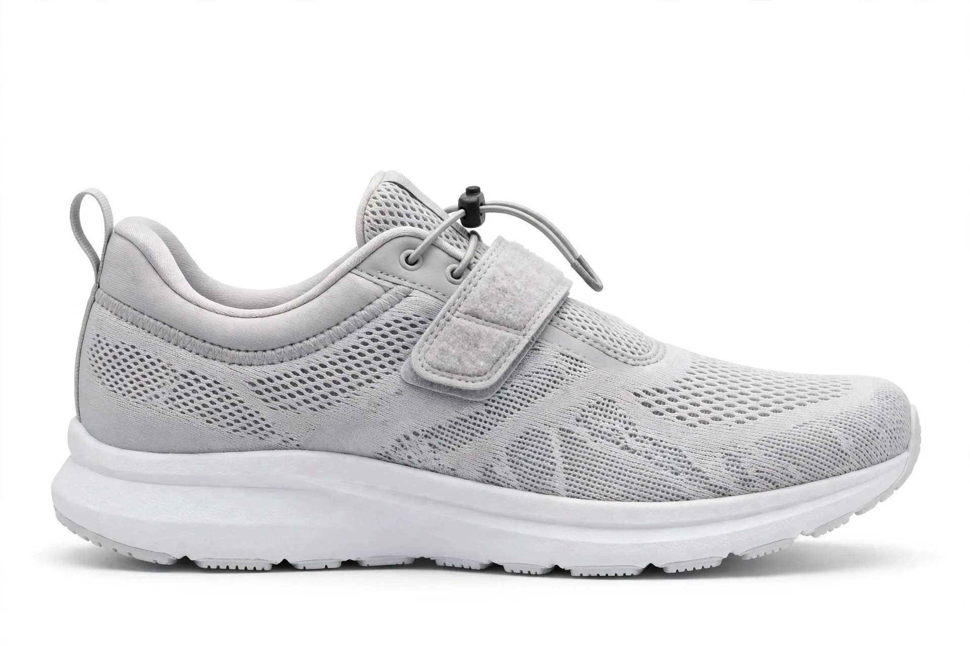 Light grey easy-on running shoe with a velcro strap and toggle closure