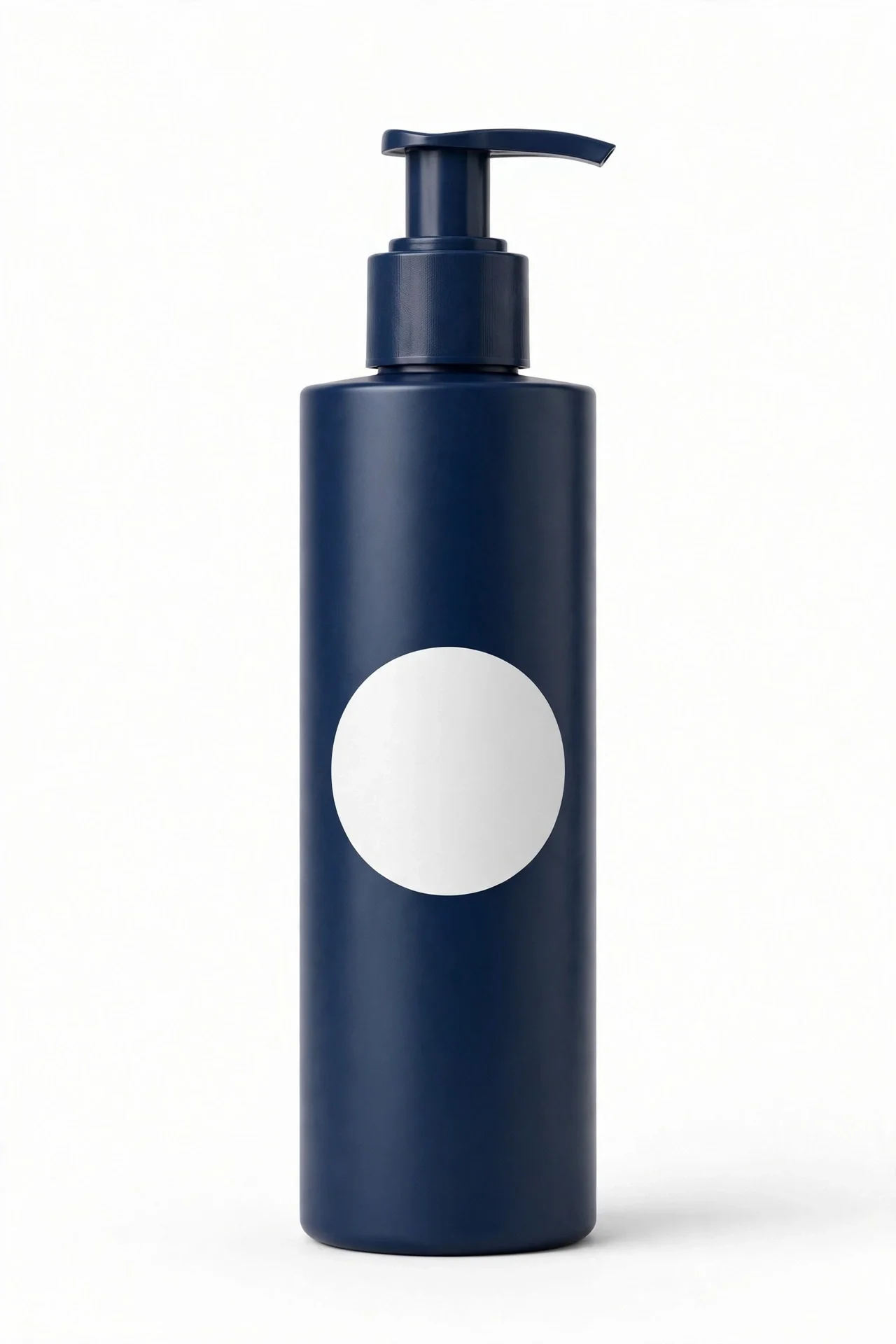 Tall dark blue pump bottle of body lotion with a plain white circular label area