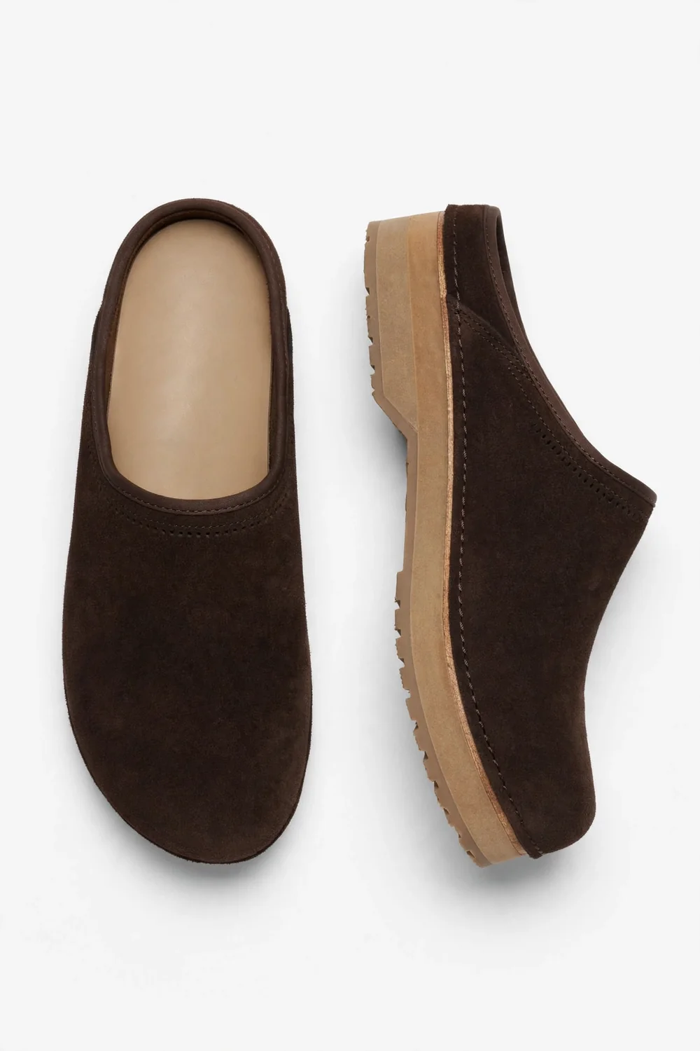 Pair of dark-brown suede closed-toe clogs on a white background, one from above with a plain tan insole, one in side profile