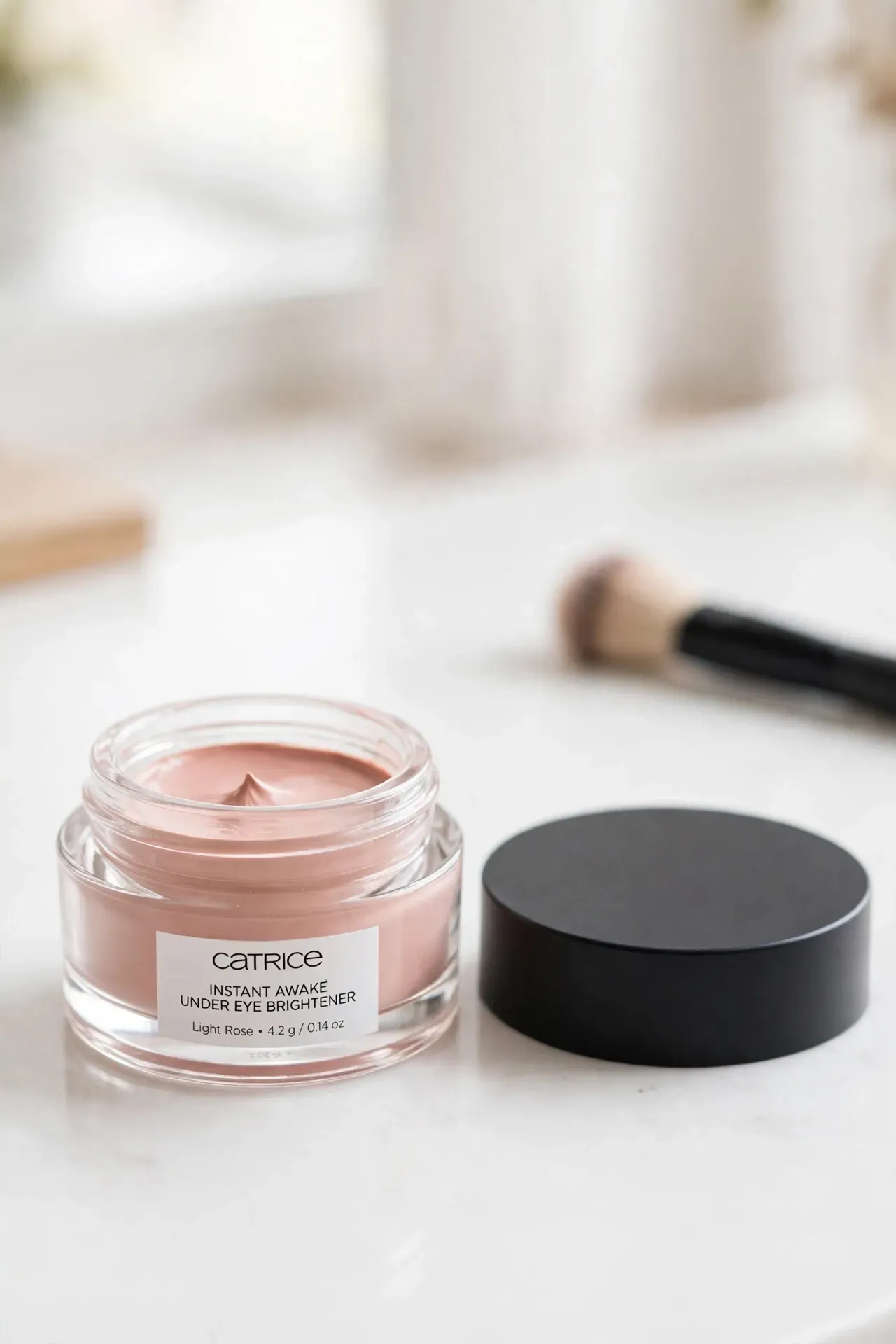 Small pot of Catrice Instant Awake under eye brightener in Light Rose