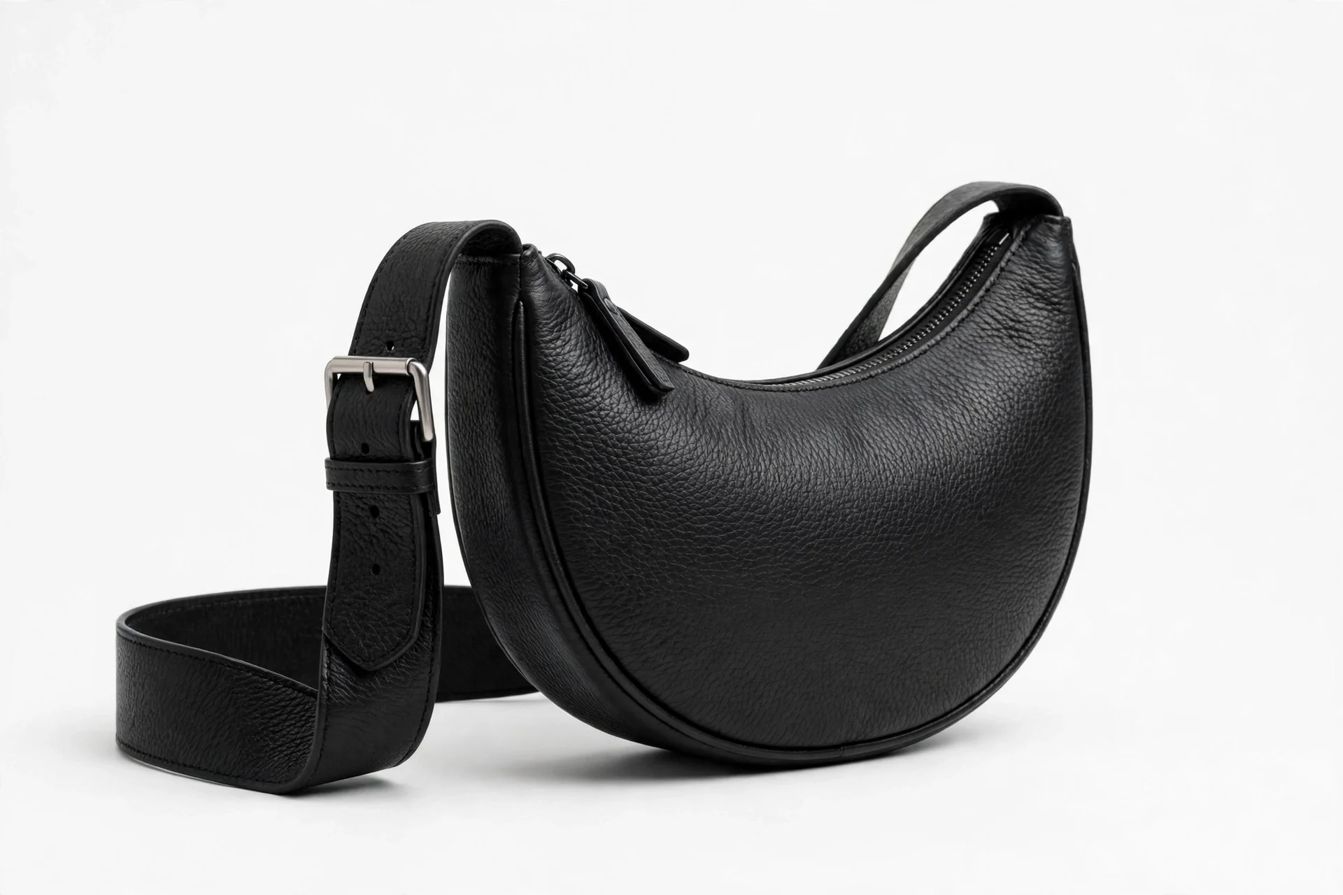 Black leather crescent sling bag with wide strap