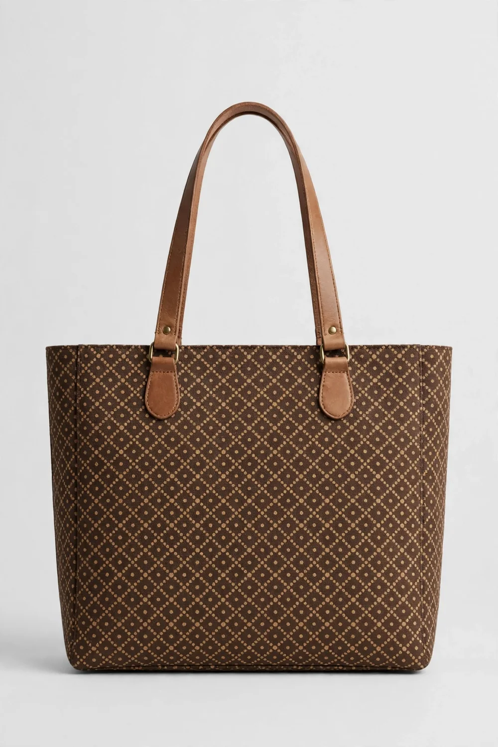A large brown monogram-pattern canvas tote handbag with tan leather handles