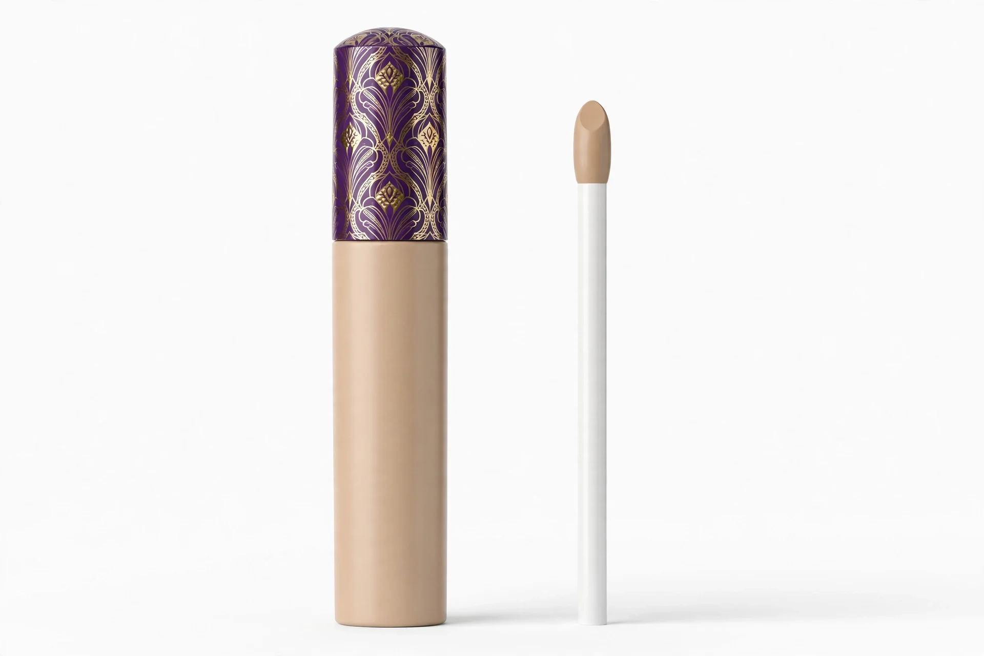 Beige concealer tube with a purple and gold patterned cap and a white applicator wand beside it